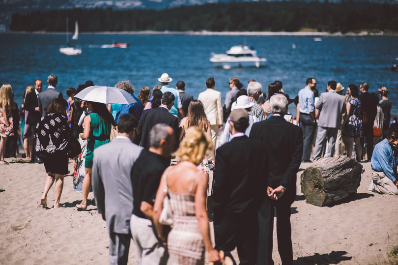 wedding guests meeting at kitsilano beach for wedding