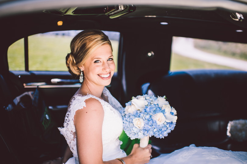 Bride in limo on wedding day
