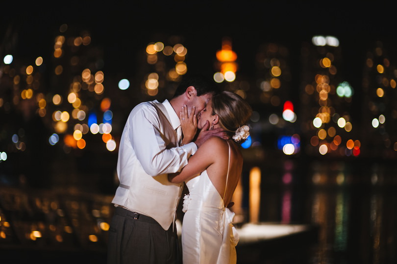 wedding photography taken at night with the city in the background