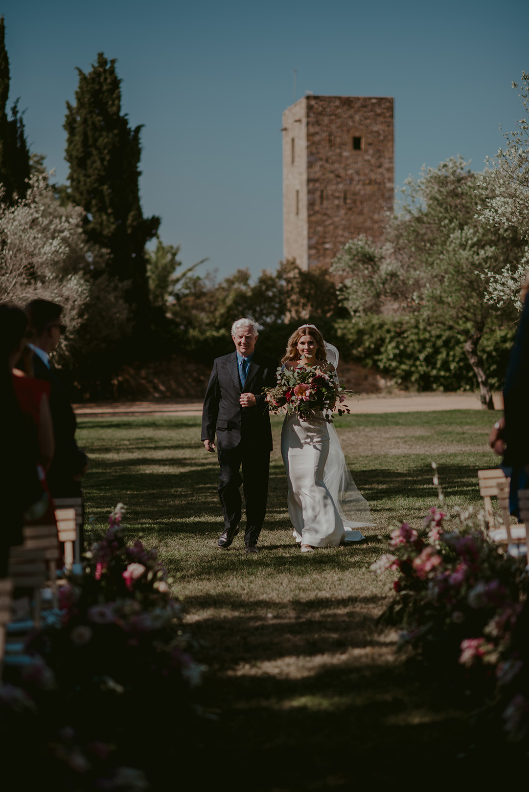 bride-walking-down-the-aisle-at-famous-wedding-venue-castell-emporda