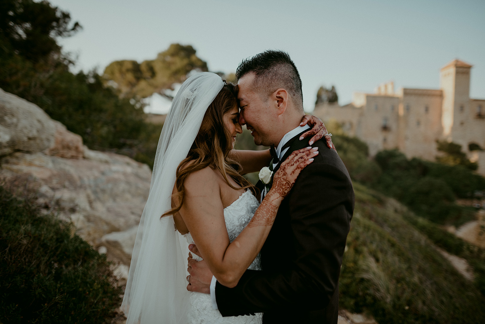 bride-and-groom-celebrate-outside-of-barcelona-wedding-venue-castell-de-tamarit
